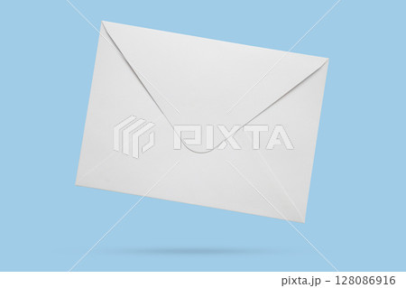 White paper envelope isolated on blue background White paper envelope isolated on blue background 128086916