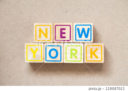Alphabet letter block in word new york on wood background 128087021