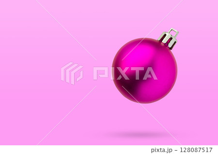Pink Christmas ball isolated on pink background Pink Christmas ball isolated on pink background 128087517