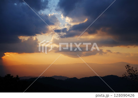 Silhouette and cloud in sunset and golden sunlight Illuminating on the valley mountain view in Chiangmai Province of Thailand Silhouette and cloud in sunset and golden sunlight Illuminating on the valley mountain view in Chiangmai Province of Thailand 128090426