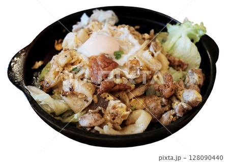 Stir fried rice noodles and chicken with fried egg and vegetable in hot pot isolated on white background. Traditional food in Thailand 128090440