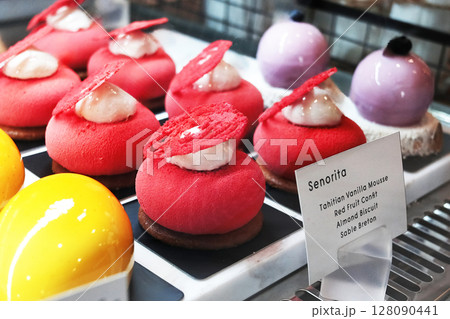 Homemade fresh vanilla mousse red fruit and almonds and chocolate biscuit in cafe 128090441