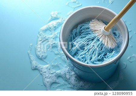 Top view. Cleaning tools. Home cleaning. Bucket with mop and water on a white background. Janitors, offices and professional cleaning services. Top view. Cleaning tools. Home cleaning. Bucket with mop and water on a white background. Janitors, offices and professional cleaning services. 128090955