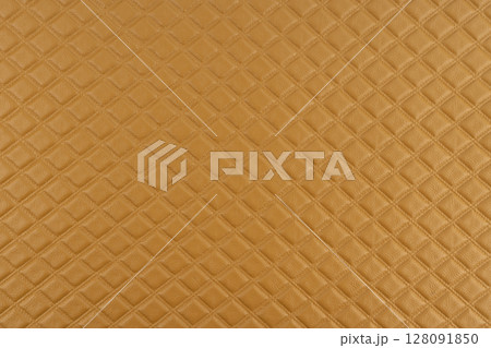 Brown macro leather texture, Synthetic leather brown background texture. Brown leather textured background. Brown macro leather texture, Synthetic leather brown background texture. Brown leather textured background. 128091850