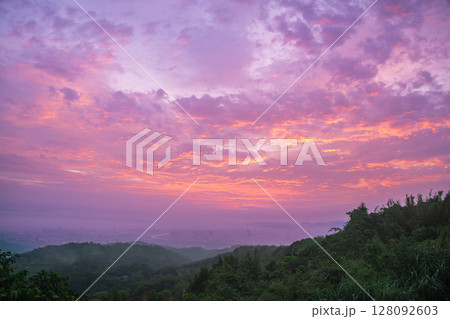 Dramatic Sunset Over Shulin Mountains and Distant Cityscape Taiwan. Dramatic Sunset Over Shulin Mountains and Distant Cityscape Taiwan. 128092603
