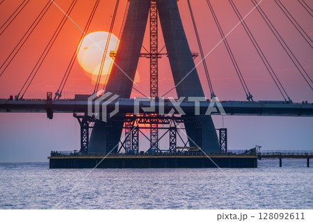Dramatic Sunset Behind Danshui New Taipei Cable Bridge Under Construction. Dramatic Sunset Behind Danshui New Taipei Cable Bridge Under Construction. 128092611