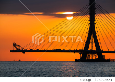 Fiery Sunset with Danshui New Taipei Taiwan Cable Bridge Silhouette. Fiery Sunset with Danshui New Taipei Taiwan Cable Bridge Silhouette. 128092624