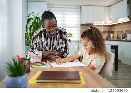Tutor and child with drawing while enjoying quality time 128093650
