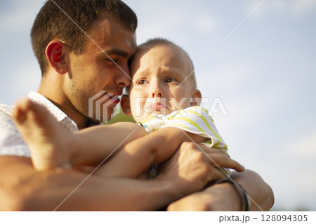 Happy dad comforts his little crying son.Paternity Happy dad comforts his little crying son.Paternity 128094305
