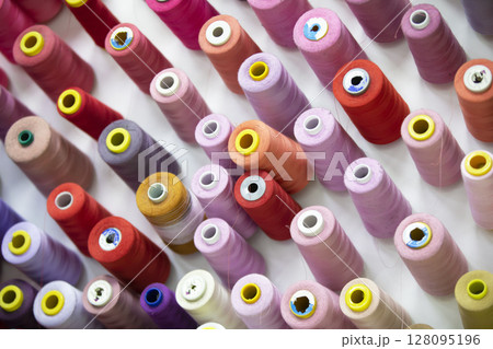 Spools of thread in various colors for the sewing studio. 128095196