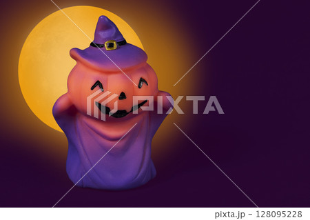 Halloween pumpkin doll on a yellow moon background. 128095228