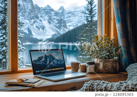 remote work setup in mountain cabin with laptop and coffee, 128095303