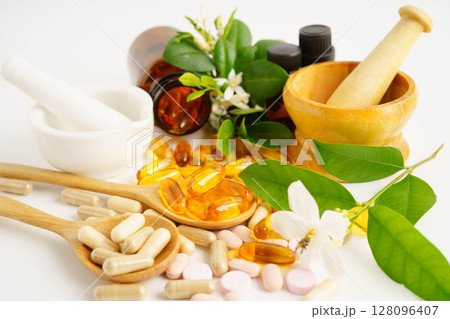 Alternative medicine herbal organic capsule with vitamin E omega 3 fish oil, mineral, drug with herbs leaf natural supplements for healthy good life. 128096407