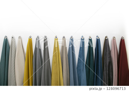Samples of fabrics for sewing furniture on a white background. Samples of fabrics for sewing furniture on a white background. 128096713