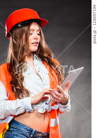 Woman structural engineer with tablet working. Woman structural engineer with tablet working. 128097199