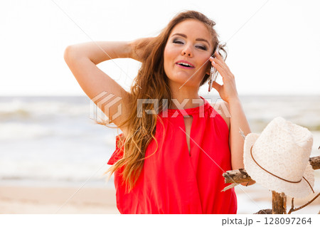 Smiling woman with mobile phone. Smiling woman with mobile phone. 128097264