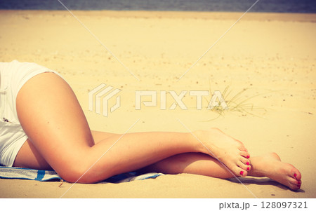Woman resting on beach. Woman resting on beach. 128097321