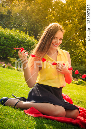 Young happy woman with hearts 128097366