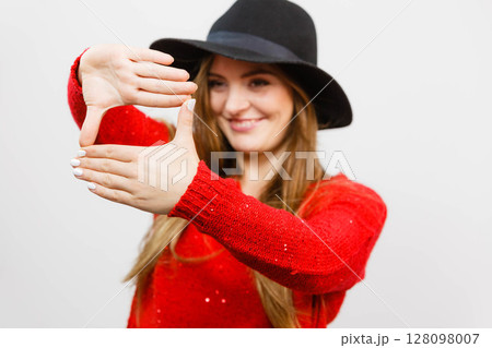 Young lady making camera gesture. Young lady making camera gesture. 128098007