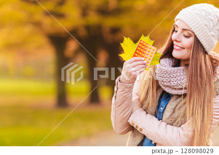 Woman with pills outdoor Woman with pills outdoor 128098029