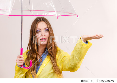 Woman in rainproof coat with umbrella. Forecasting Woman in rainproof coat with umbrella. Forecasting 128098079