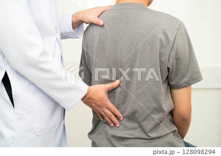 Physical therapy, Asian therapist doctor treat perform pain young man in hospital. 128098294