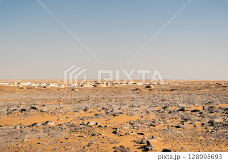 White rock formations and sand dunes in Egypt's White Desert, natural desert landscape White rock formations and sand dunes in Egypt's White Desert, natural desert landscape 128098693