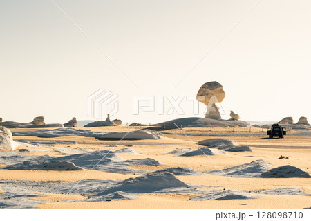 White rock formations and sand dunes in Egypt's White Desert, natural desert landscape White rock formations and sand dunes in Egypt's White Desert, natural desert landscape 128098710