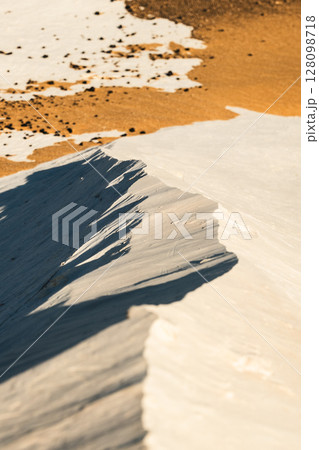 White rock formations and sand dunes in Egypt's White Desert, natural desert landscape	 128098718