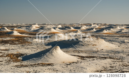 White rock formations and sand dunes in Egypt's White Desert, natural desert landscape	 128098728