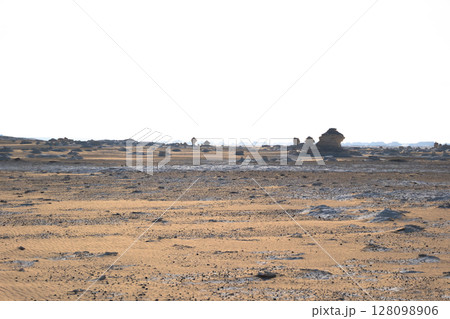 White rock formations and sand dunes in Egypt's White Desert, natural desert landscape White rock formations and sand dunes in Egypt's White Desert, natural desert landscape 128098906