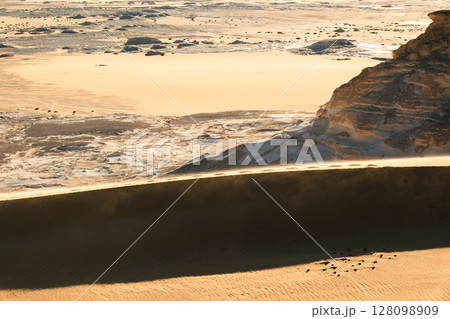 White rock formations and sand dunes in Egypt's White Desert, natural desert landscape White rock formations and sand dunes in Egypt's White Desert, natural desert landscape 128098909