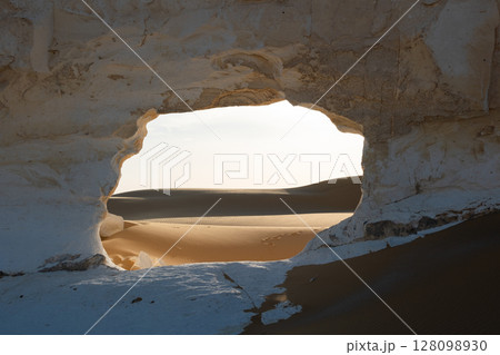 White rock formations and sand dunes in Egypt's White Desert, natural desert landscape White rock formations and sand dunes in Egypt's White Desert, natural desert landscape 128098930