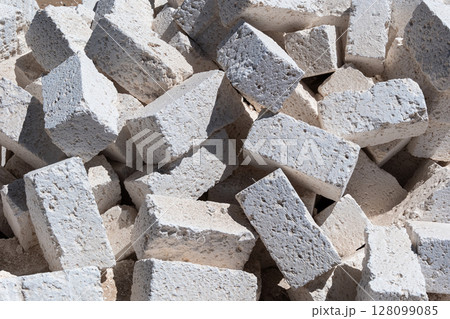 White concrete foundation blocks for construction, building materials and site preparation	 128099085