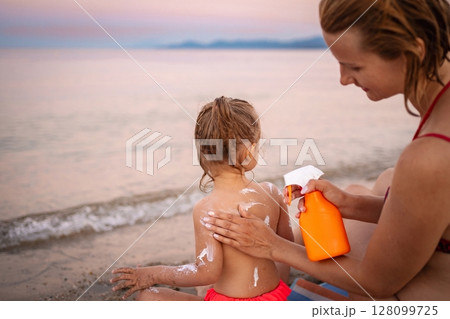 Sunny beach day in Greece with mother and child Sunny beach day in Greece with mother and child 128099725