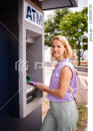 Summer moments at the ATM in Greece by the coast 128099726