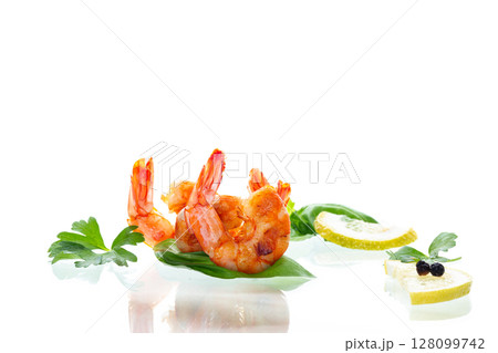 Delicious sea shrimps with lemon isolated on white 128099742