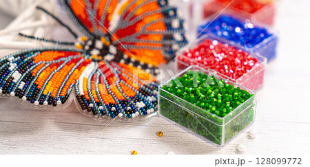Colorful glass beads. Variety of shapes and colors to make a bead necklace or a string of beads for women Colorful glass beads. Variety of shapes and colors to make a bead necklace or a string of beads for women 128099772