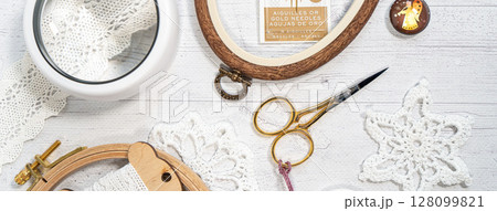 Accessories for hobby. Hoop snaps, scissors, threads, needles and scissors. Vintage tools for embroidery and knitting 128099821