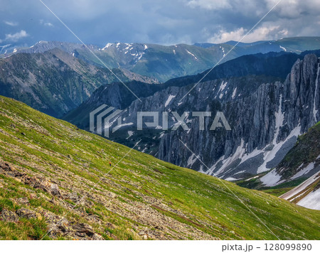 landscape with sunlit diagonal green mountainside 128099890