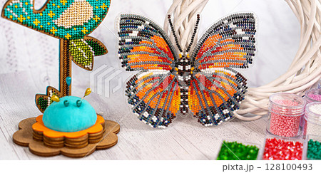 Colorful glass beads. Variety of shapes and colors to make a bead necklace or a string of beads for women 128100493