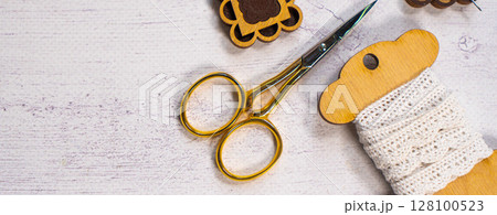 Accessories for hobby. Hoop snaps, threads, needles and scissors. Vintage tools for embroidery and knitting 128100523