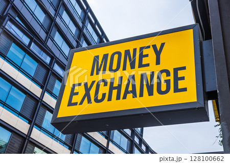 Hanging Money Exchange board in city financial district offers travel cash and forex service 128100662