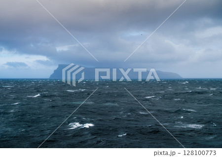 Faroe Islands, Denmark. Nordic Nature. Scandinavia. View of the ocean and the mountains. Faroe Islands, Denmark. Nordic Nature. Scandinavia. View of the ocean and the mountains. 128100773