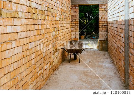 construction residential new house in progress at building site. High quality photo construction residential new house in progress at building site. High quality photo 128100812