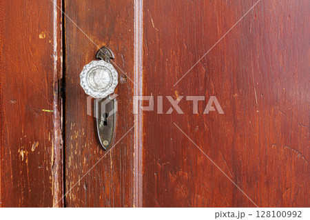 Vintage Wooden Door Lock and Latch on Aged Red Brown Timber Surface Vintage Wooden Door Lock and Latch on Aged Red Brown Timber Surface 128100992