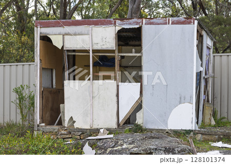 A garden shed destroyed by a winter wind storm A garden shed destroyed by a winter wind storm 128101374
