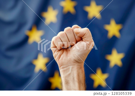 Clenched fist raised in front of the European Union flag. ai generative 128105339