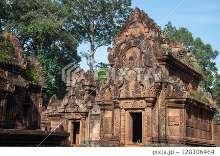 Buildings in Banteay Srei a 10th century Cambodian temple dedicated to the Hindu god Shiva made by pink and red sandstone in Siem Reap, Cambodia. Buildings in Banteay Srei a 10th century Cambodian temple dedicated to the Hindu god Shiva made by pink and red sandstone in Siem Reap, Cambodia. 128106464