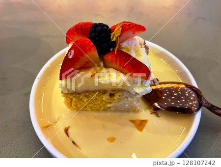 Tres Leches Cake on a small plate Tres Leches Cake on a small plate 128107242